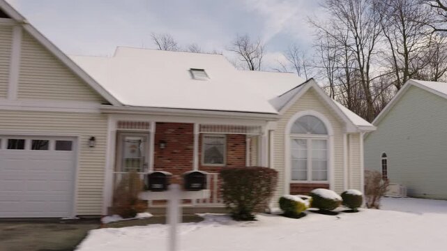 Snow-Covered Detached House in an American Suburban Neighborhood