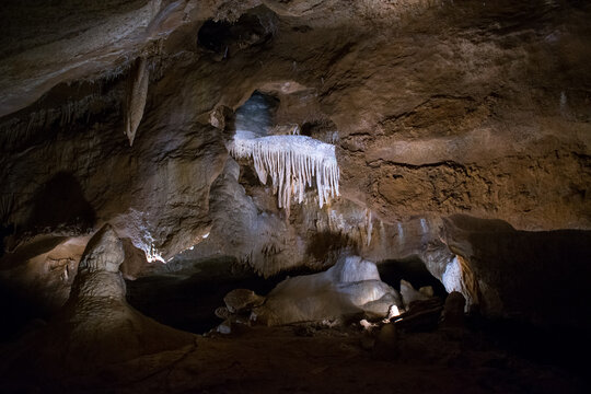 Limestone Konepruske Jeskyne cave interior with stalactites and stalagmites in Cesky Kras, Czech Republic