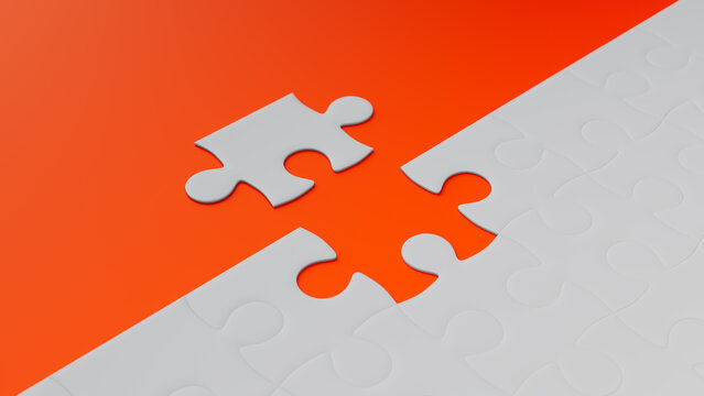 Close up of Orange Jigsaw Puzzle texture Background with final piece moving into place. Perfect Fit Concept.