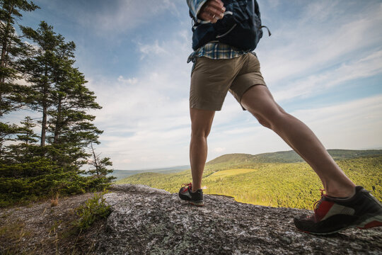 Low angle view of hiker on a mountain peak
