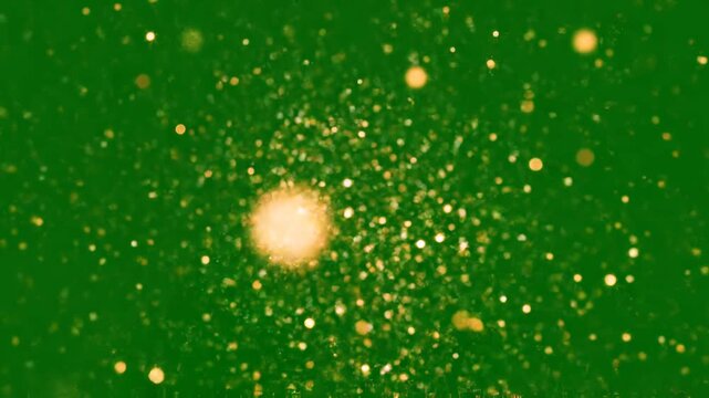 Golden particle explosion on green screen, magical dust burst overlay for motion and visual effects particles