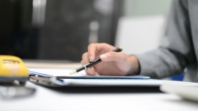 Woman signing auto insurance contract with agent after car crash claim. Trustworthy vehicle protection, policy coverage, and financial deal.