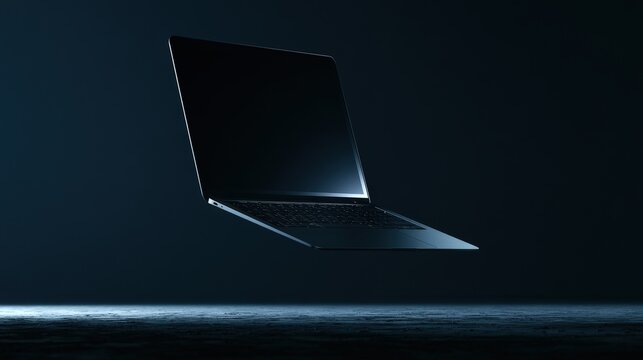 A modern laptop floating in dark atmospheric lighting with a sleek dark background. Ideal for technology and business advertisement concepts.