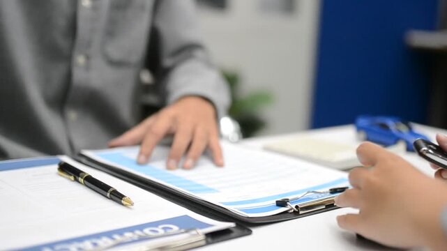 Woman signing auto insurance contract with agent after car crash claim. Trustworthy vehicle protection, policy coverage, and financial deal.