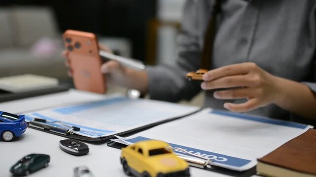 Woman signing auto insurance contract with agent after car crash claim. Trustworthy vehicle protection, policy coverage, and financial deal.