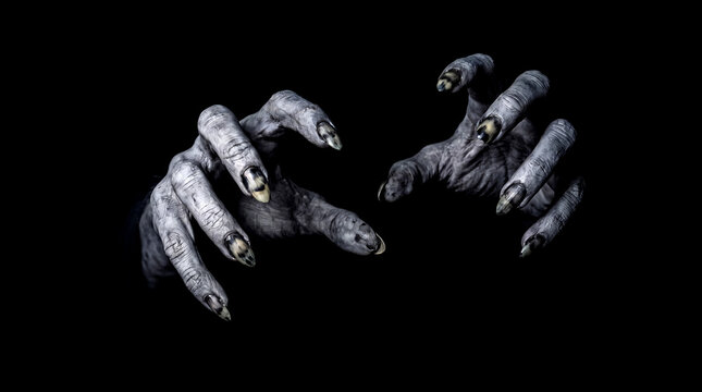 Creepy demonic hands reaching out from the dark