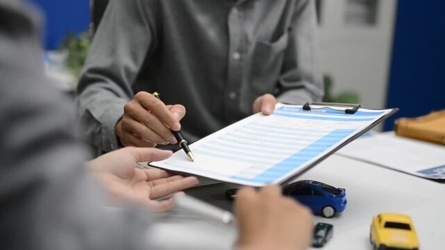 Woman signing auto insurance contract with agent after car crash claim. Trustworthy vehicle protection, policy coverage, and financial deal.