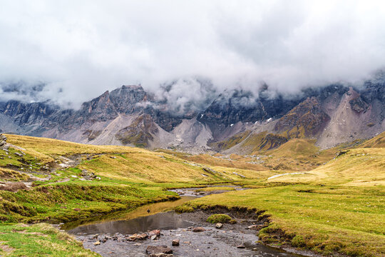 Hiking trail in Cirque de Troumouse at Heas in the Hautes-Pyrenees department in France, forming the border with Spain