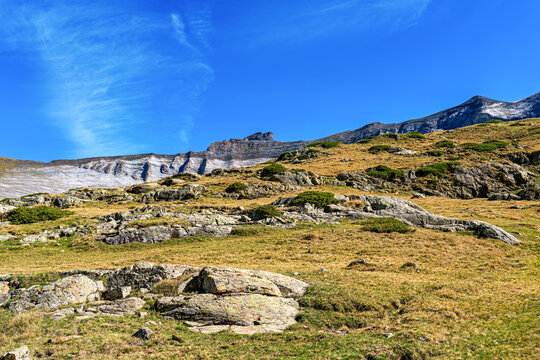 Hiking trail in Cirque de Troumouse at Heas in the Hautes-Pyrenees department in France, forming the border with Spain