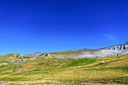 Hiking trail in Cirque de Troumouse at Heas in the Hautes-Pyrenees department in France, forming the border with Spain