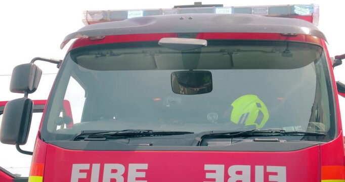 Fire truck emergency service vehicle. Red fire engine with ladders, firefighting apparatus and water to save lives, suppress wildfire, extinguish building fires and assist vehicle collisions
