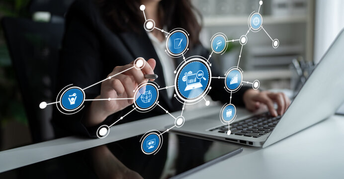A business professional engages with innovative technology, utilizing digital icons that symbolize modern management and digital communication in a corporate environment. Tessel