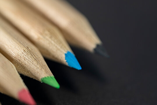 Colored pencils close up on dark background The Concept of art and creativity