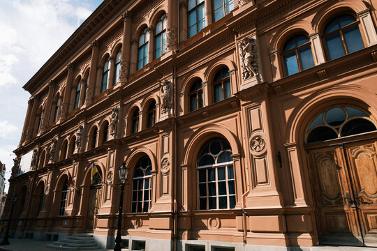 Wide low-angle view of the Venetian Renaissance style Riga Art Museum Exchange facade on Dome Square in Riga Old Town, Latvia