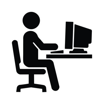 Professional worker sitting at a desk and using a desktop computer in a flat black icon vector graphic