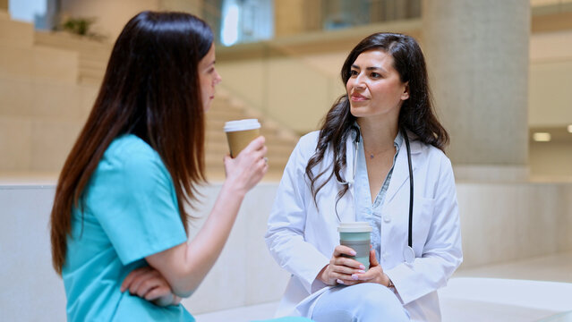 Medical professionals having coffee break and discussing work