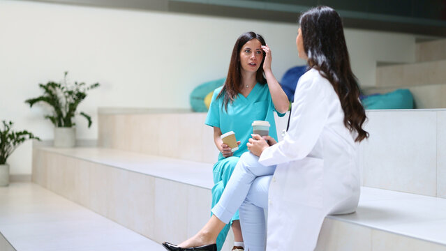 Healthcare workers having coffee break and talking