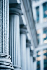 Fototapeta premium Majestic stone columns in front of a modern glass building representing law and finance