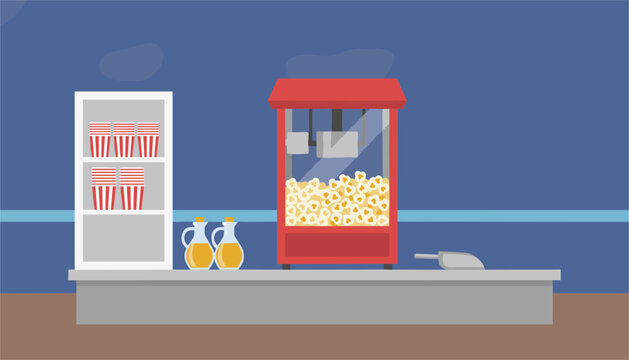 Industrial popcorn machine sits on a grey counter alongside shelves of empty red and white striped serving cups inside a professional cinema.