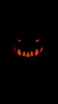 Spooky Glowing Jack O Lantern Faces on Black Background
