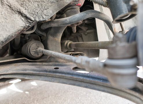 Car steering tie rod and control arm close-up