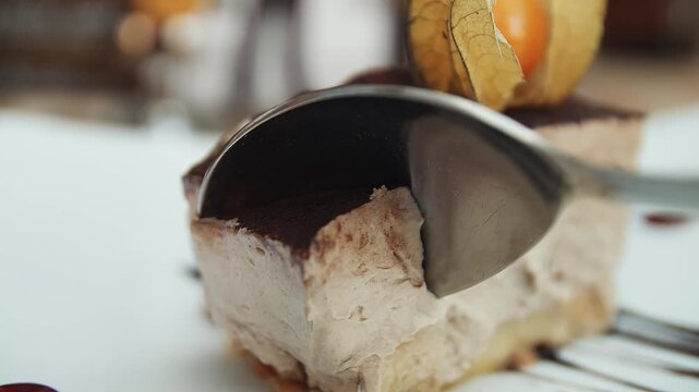 Banoffee pie being sliced with spoon to be consumed close up stock footage