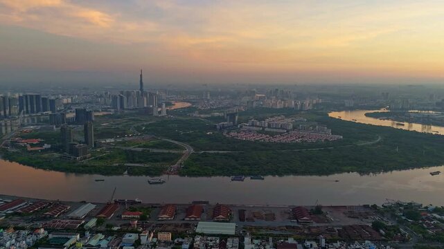 aerial panoramic sunset view of Ho Chi Minh City, featuring Thu Thiem Peninsula, Saigon River, and Landmark 81