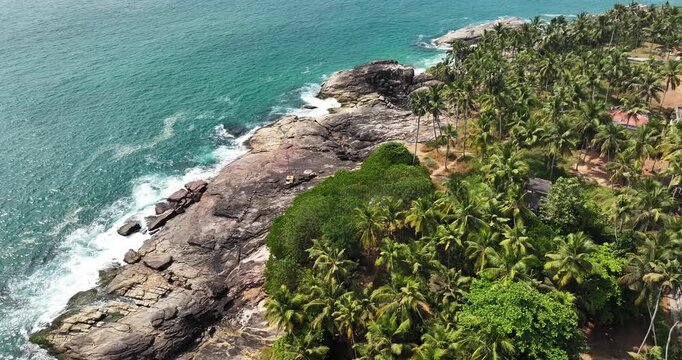 Aerial view of Karikkathi Beach near the Aazhimala Shiva Temple is a Hindu temple located on the coast of the Arabian Sea near Vizhinjam in the Thiruvananthapuram district of Kerala, India.