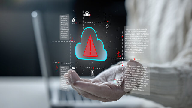 A female holding a holographic glowing cloud icon with a red warning exclamation mark, symbolizing cyber security threats, cloud failure, data breach, and IT risk. Cloud computing network data concept