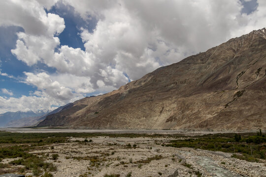 Dramatic mountain valley under storm clouds