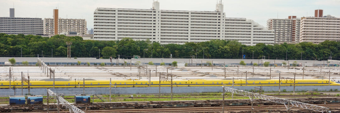Tokyo, Japan - July 19 2013: Doctor Yellow inspection train and Tokaido Shinkansen bullet trains parked at Oi Rail Depot in Tokyo, Japan.
