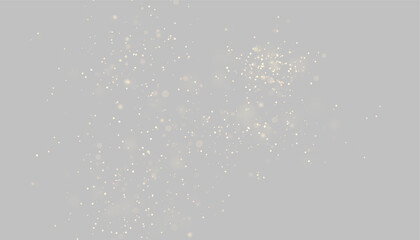 Delicate trail of soft golden light particles scattered on transparent background © ikril