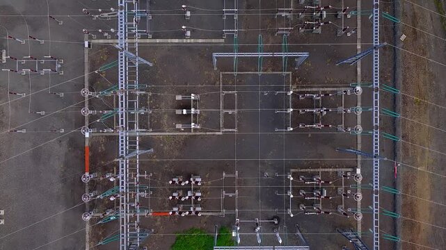 Aerial view of an electrical substation with complex power cables and industrial infrastructure in Iceland.