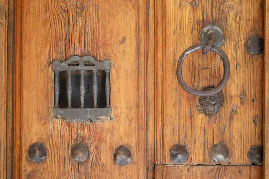 Vintage wooden door with wrought iron details