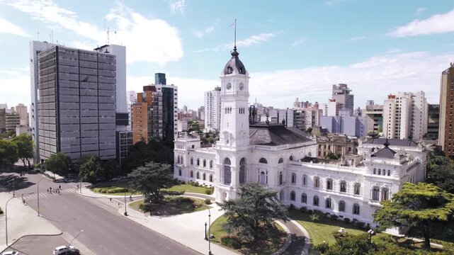 4K drone aerial view of La Plata City Hall in Buenos Aires, Argentina. Historic municipal building overlooking Plaza Moreno, featuring distinctive European-inspired architecture in the city center.