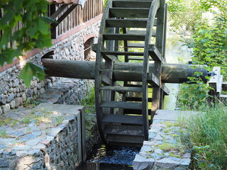 Wooden mill wheel by the stream © andsyphoto
