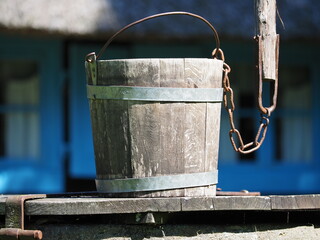 Brown wooden bucket with metal rims © andsyphoto