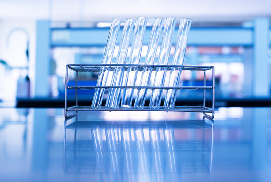 test tube in metal rack at science research laboratory background	