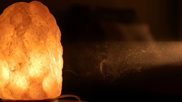 Dust Motes Drifting in the Warm Glow of a Salt Lamp