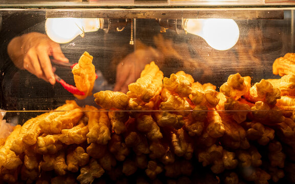 Vendor Selecting Crispy Fried Dough Stick