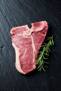 Raw porterhouse steak with rosmary