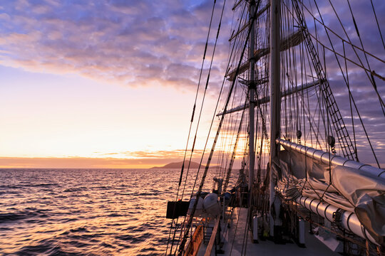 Pacific Ocean, sailing ship at Galapagos Islands at sunset