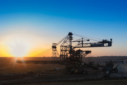 Germany, North Rhine-Westphalia, Juechen, Garzweiler surface mine, Stacker during repair at sunset