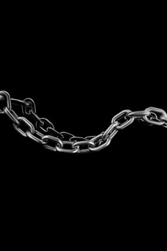 A heavy metal chain hangs against a black background