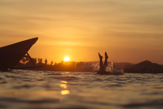 Indonesia, Lombok, man jumping into water