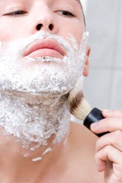 Man applying shaving foam
