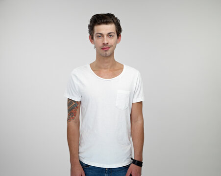 Portrait of young man with tattoo