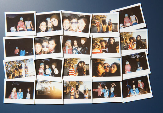 Mockup of Multiple empty polaroid frames are placed on a blue surface. They are aligned in a grid style. Each frame is ready for pictures