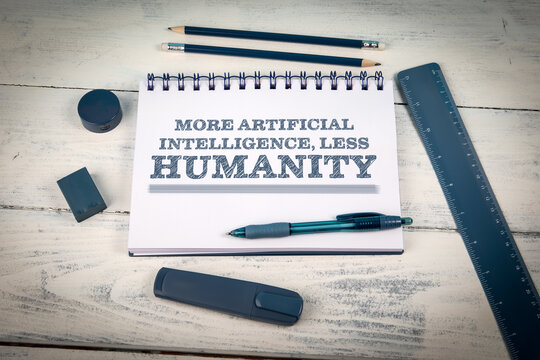 MORE ARTIFICIAL INTELLIGENCE, LESS HUMANITY Message on an Office Notebook