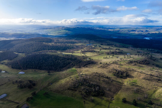 rolling green farmlands, country roads, and dams in a scenic Australian valley summer